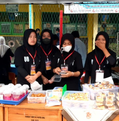 Photo 11: Students planting trees in school garden, environmental awareness activity