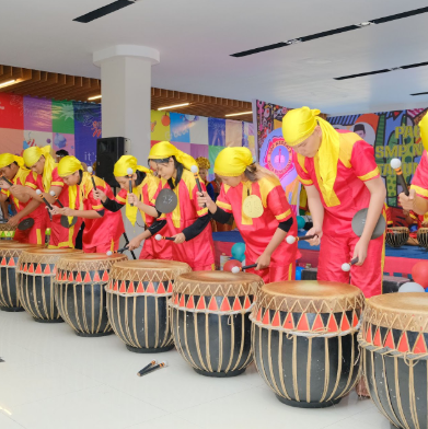 Photo 3: Art class students painting colorful canvases with brushes and palettes in a bright studio